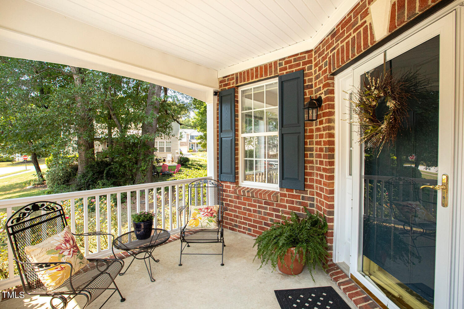 2013 Prairie Ridge Court Fuquay-Varina, NC 27526 - Photo 3 of 53 a balcony view with a potted plant and outdoor seating