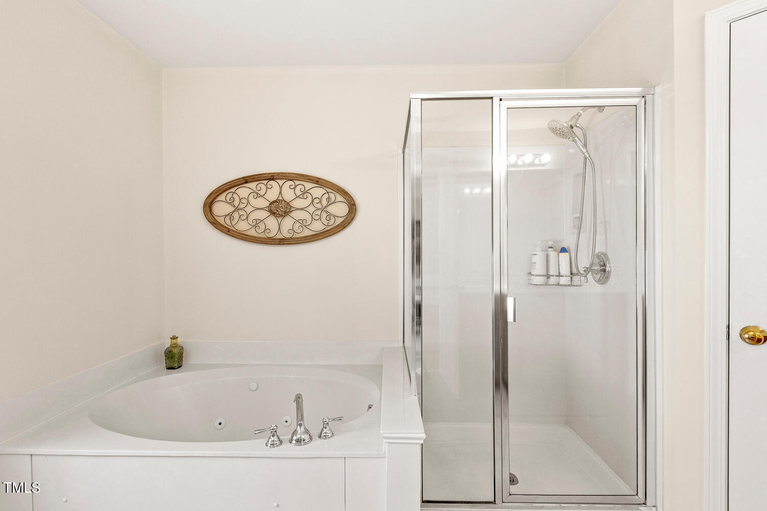 2013 Prairie Ridge Court Fuquay-Varina, NC 27526 - Photo 31 of 53 a bathroom with a bathtub and shower