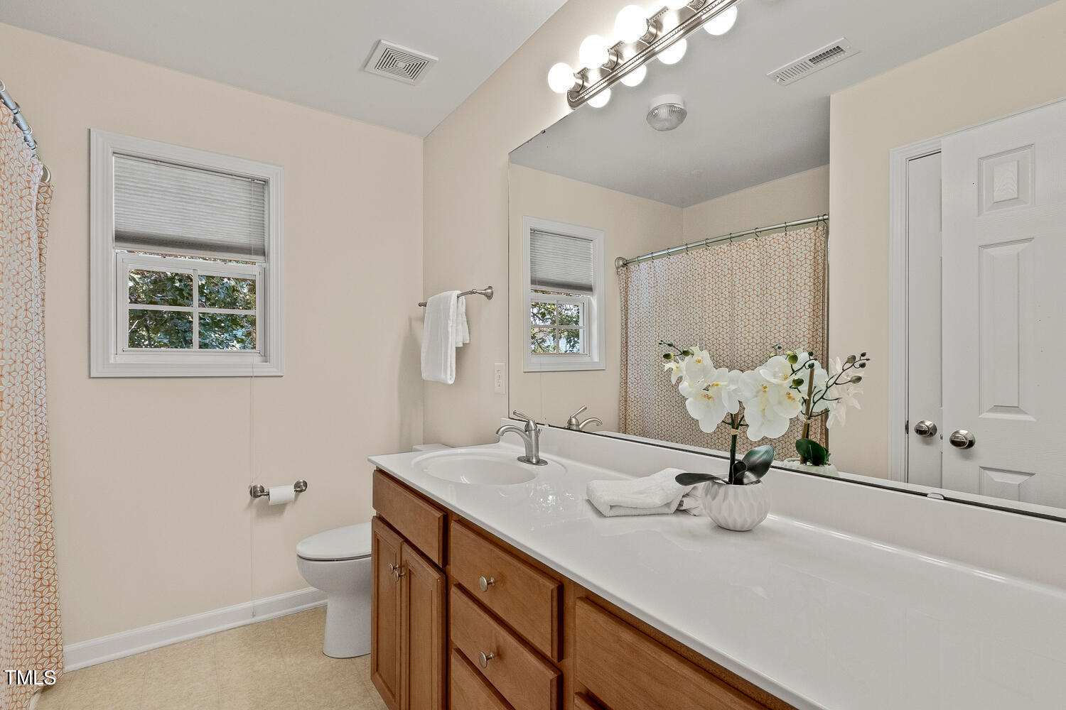 2013 Prairie Ridge Court Fuquay-Varina, NC 27526 - Photo 36 of 53 a bathroom with a sink a vanity and a mirror