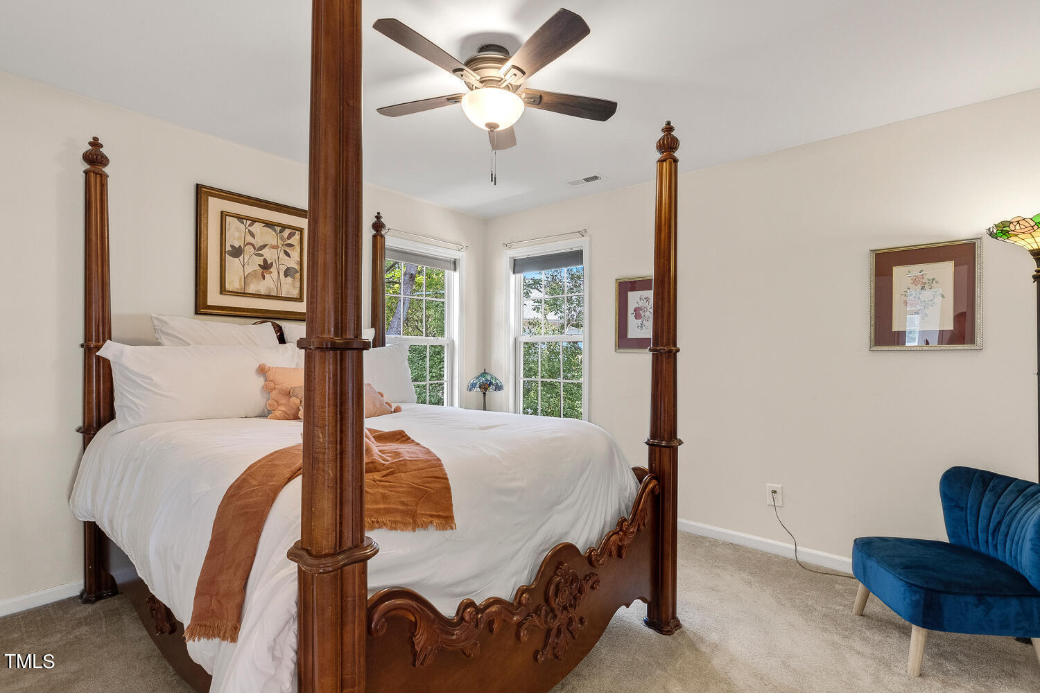 2013 Prairie Ridge Court Fuquay-Varina, NC 27526 - Photo 37 of 53 a bedroom with a bed and a chandelier