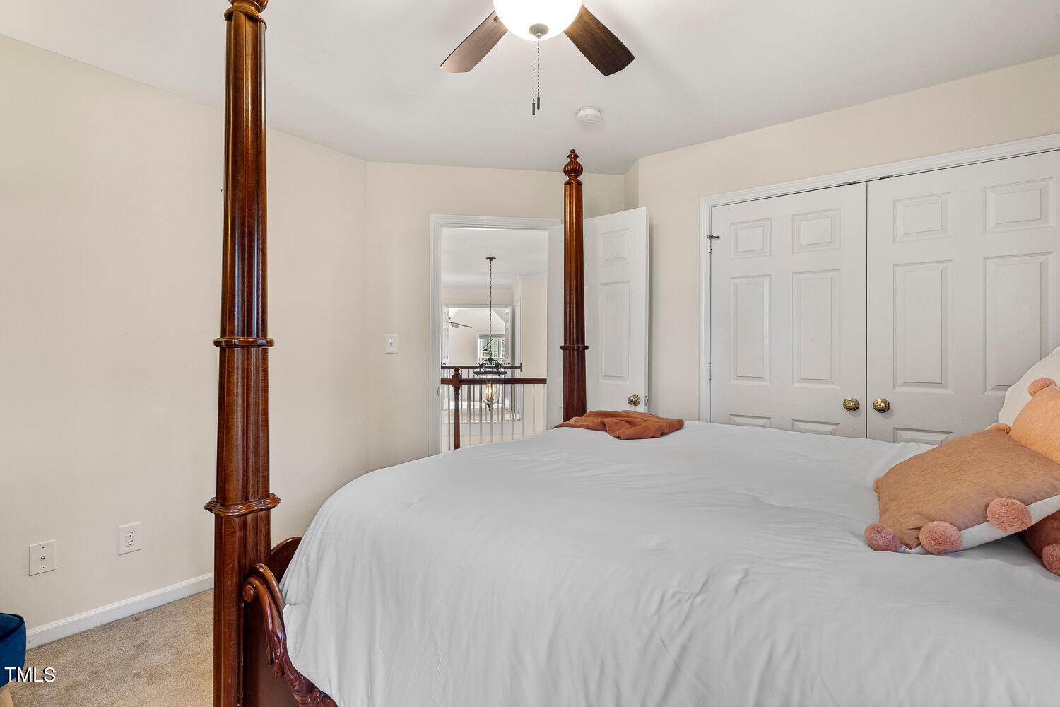 2013 Prairie Ridge Court Fuquay-Varina, NC 27526 - Photo 38 of 53 a bedroom with a large bed and a chandelier