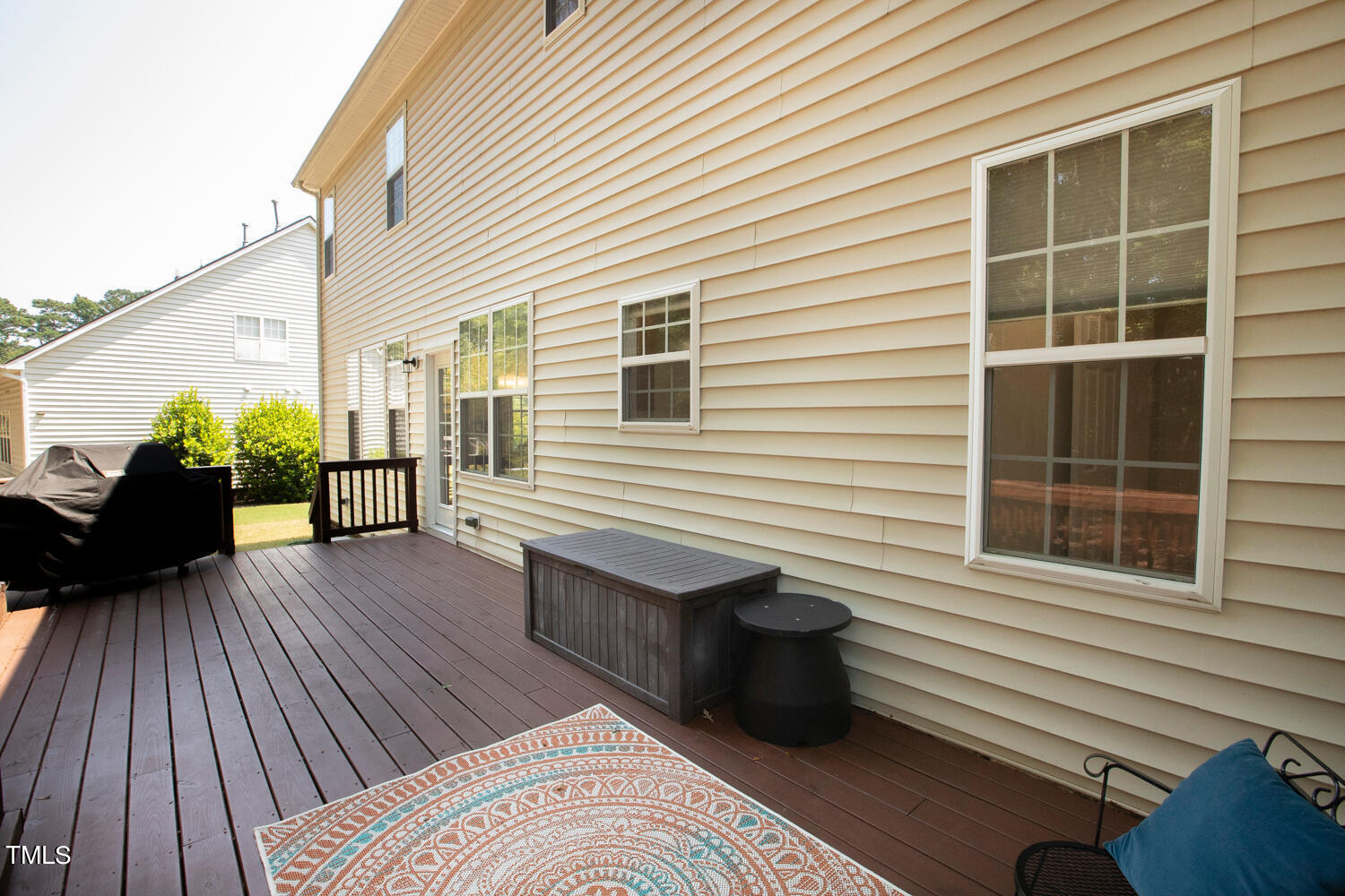 2013 Prairie Ridge Court Fuquay-Varina, NC 27526 - Photo 42 of 53 a view of a balcony with chairs and wooden floor
