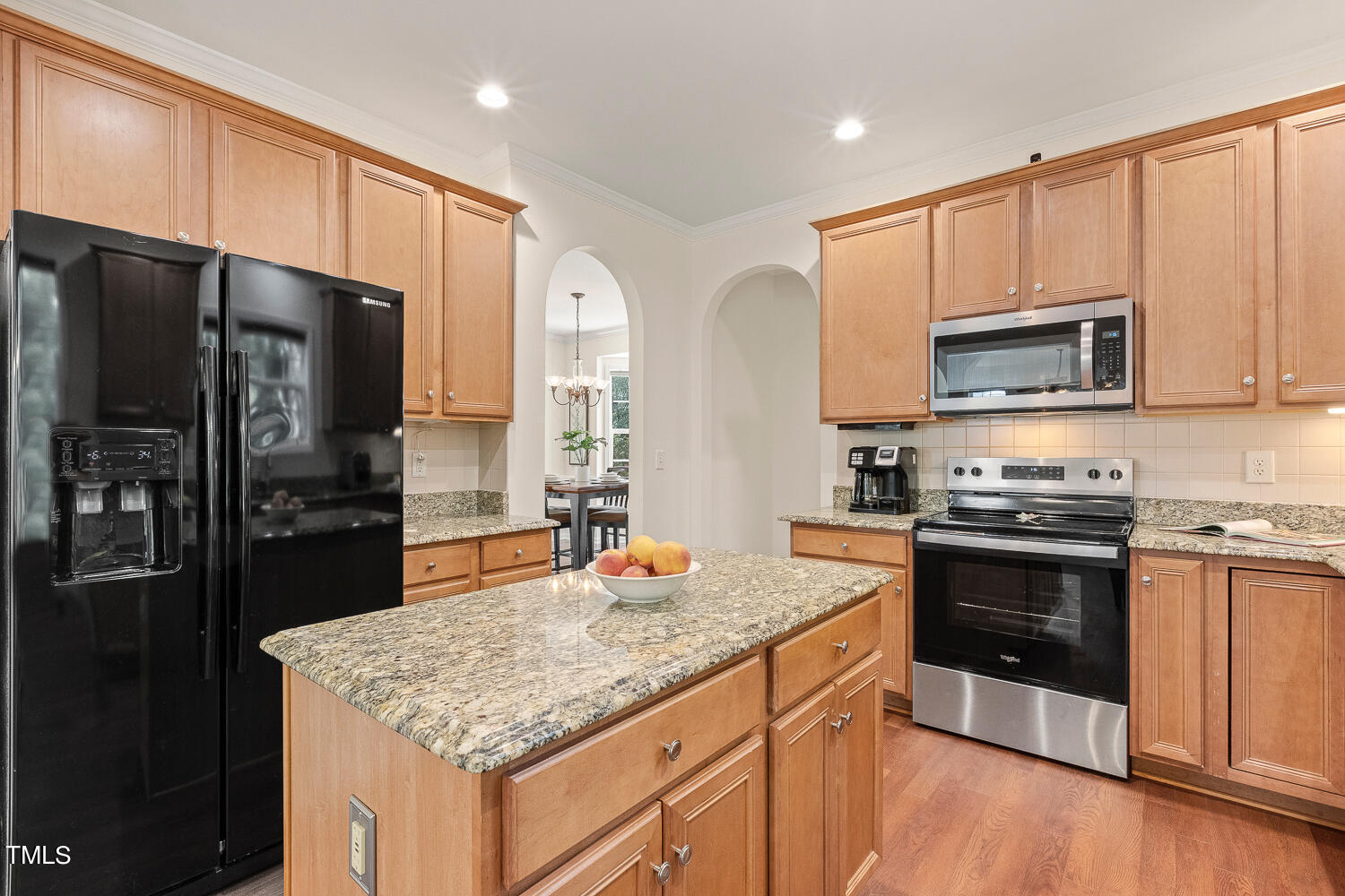 2013 Prairie Ridge Court Fuquay-Varina, NC 27526 - Photo 8 of 53 a kitchen with stainless steel appliances granite countertop a stove refrigerator sink and microwave