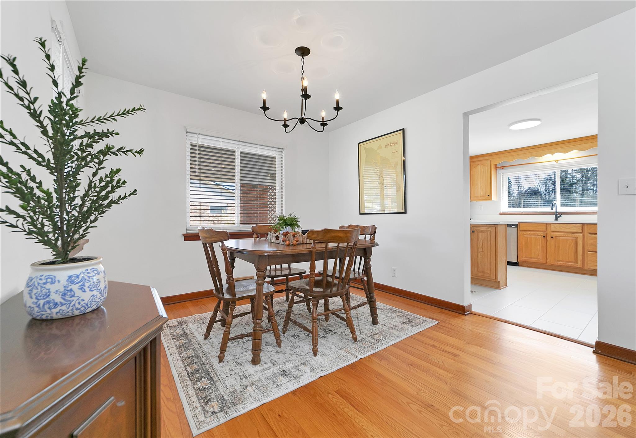 112 Allison Road Brevard, NC 28712 - Photo 11 of 37 a view of a dining room with furniture window and wooden floor