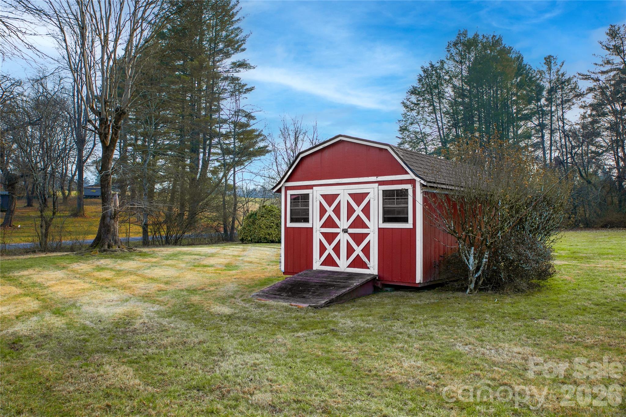112 Allison Road Brevard, NC 28712 - Photo 30 of 37 a sign that is sitting in the grass near a tree