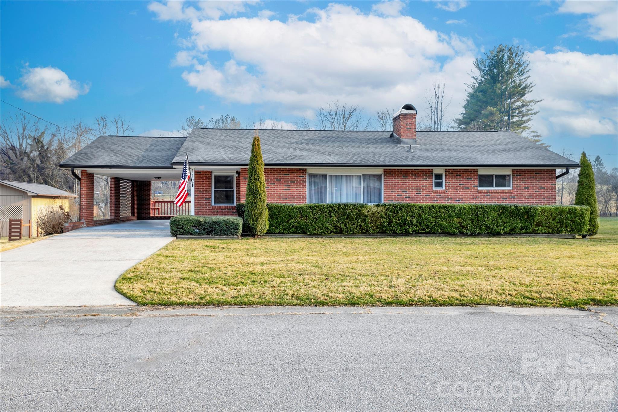 112 Allison Road Brevard, NC 28712 - Photo 36 of 37 a front view of house with yard and outdoor seating