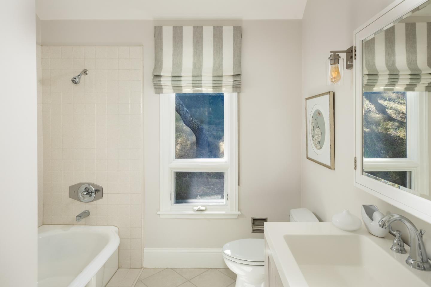 345 Harcross Road Woodside, CA 94062 - Photo 24 of 37 a bathroom with a sink toilet and shower
