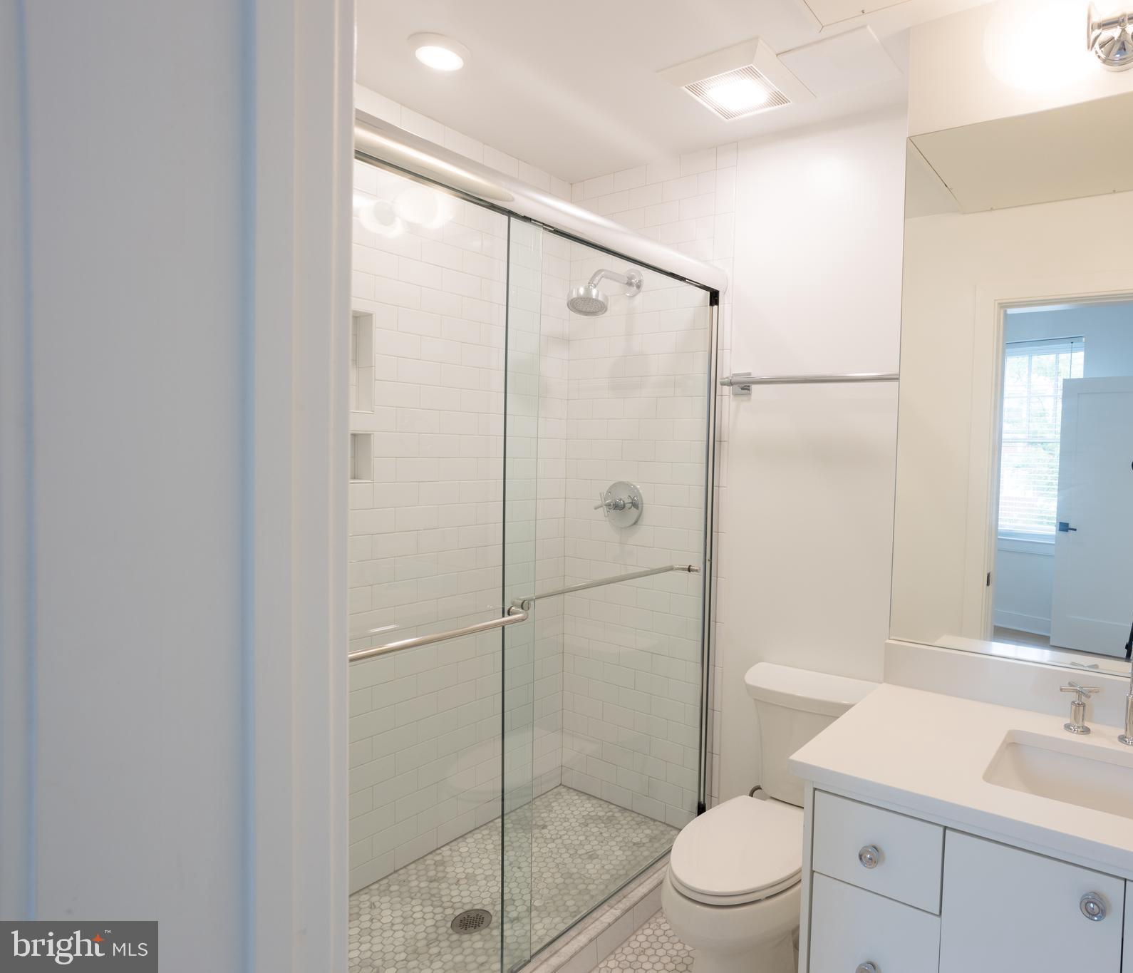 2869 28th Street Northwest, Unit 204 Washington, DC 20008 - Photo 7 of 19 a bathroom with a shower a toilet and sink