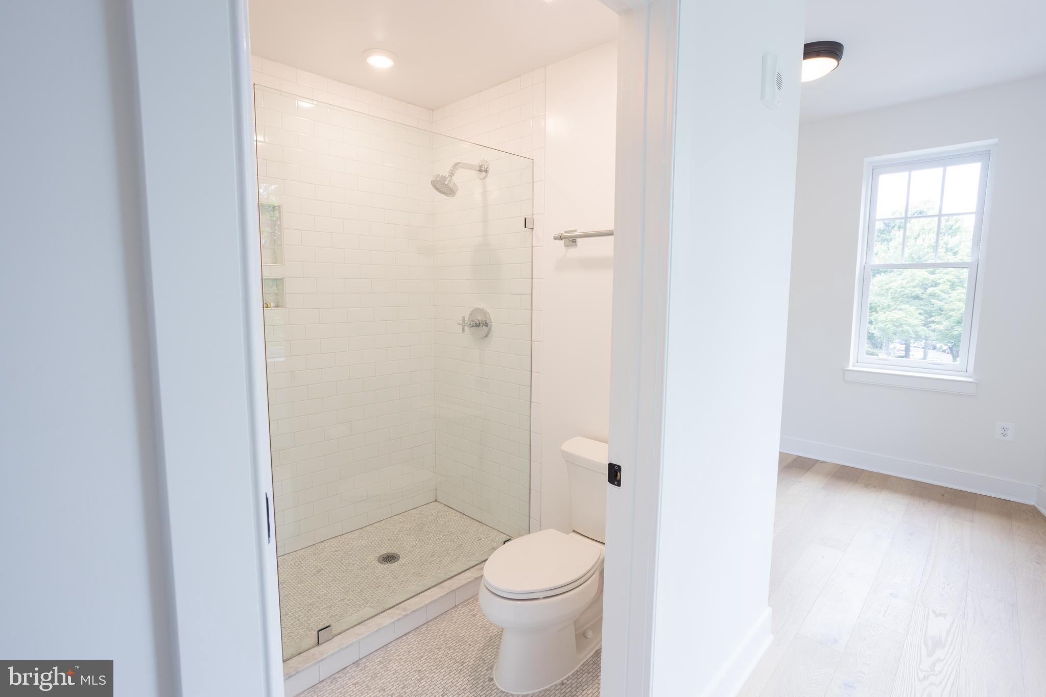 2869 28th Street Northwest, Unit 204 Washington, DC 20008 - Photo 10 of 19 a bathroom with a shower toilet and sink