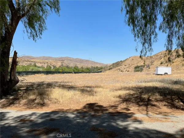 a wooden bench sitting in front of a building