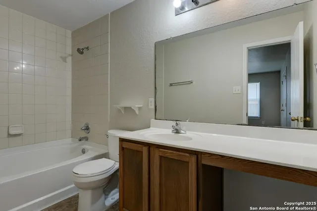 a view of yard with trees in the background