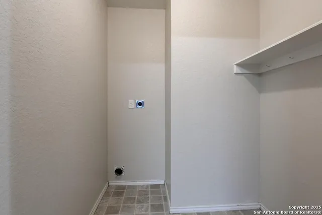 a view of backyard with wooden fence