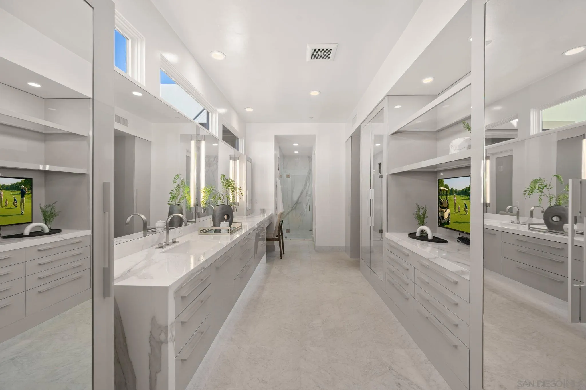 6968 St Andrews Road Rancho Santa Fe, CA 92067 - Photo 19 of 23 a large en suite bathroom with a granite countertop sink mirror and bathtub