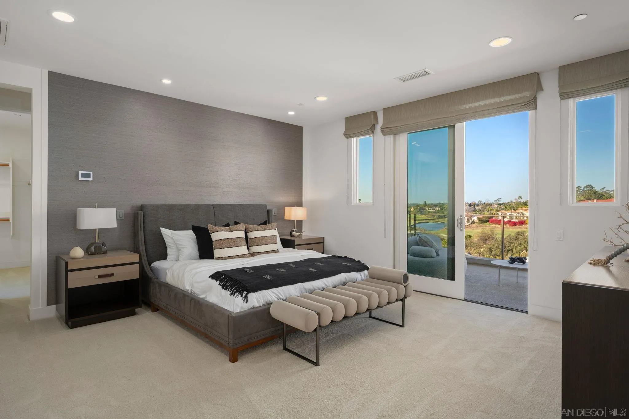 6968 St Andrews Road Rancho Santa Fe, CA 92067 - Photo 22 of 23 a spacious bedroom with a bed and glass door