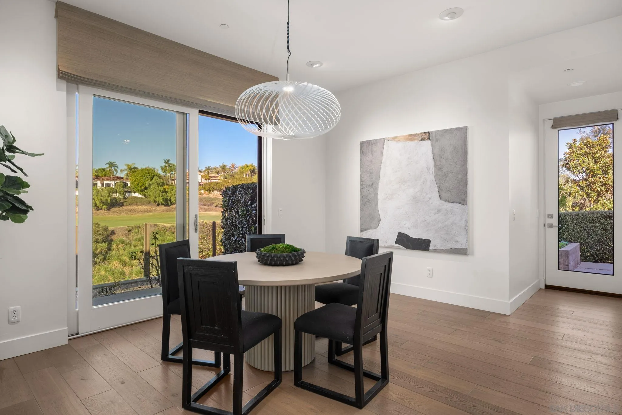6968 St Andrews Road Rancho Santa Fe, CA 92067 - Photo 8 of 23 a view of a dining room with furniture window and wooden floor