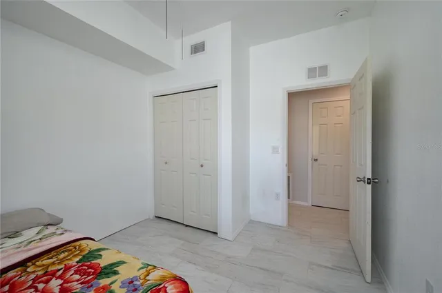 a view of bedroom with a bed and closet