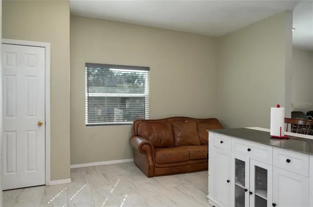 a living room with furniture and a window