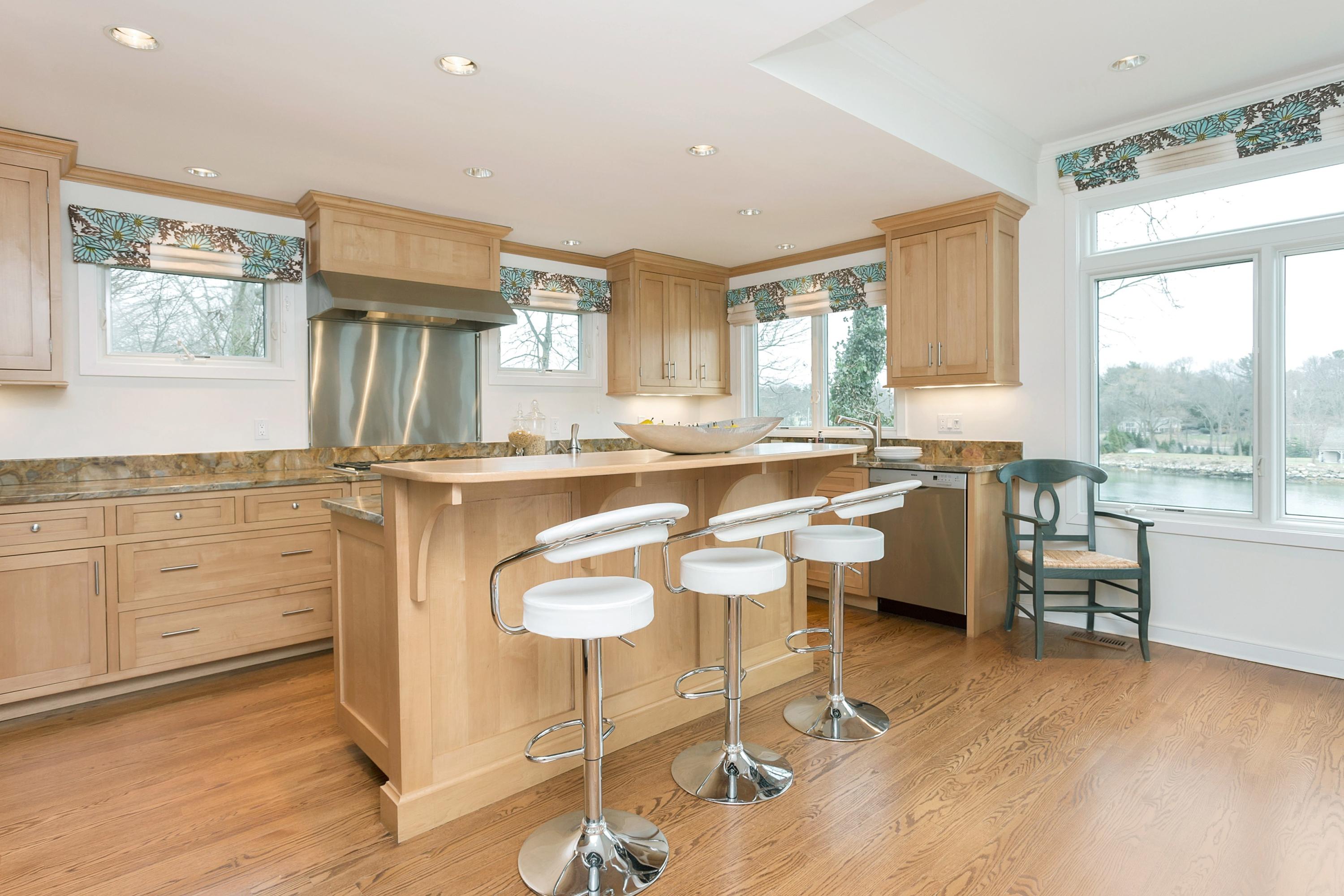 17 Thomas Place Rowayton, CT 06853 - Photo 14 of 37 a kitchen with a sink cabinets and dining table chair