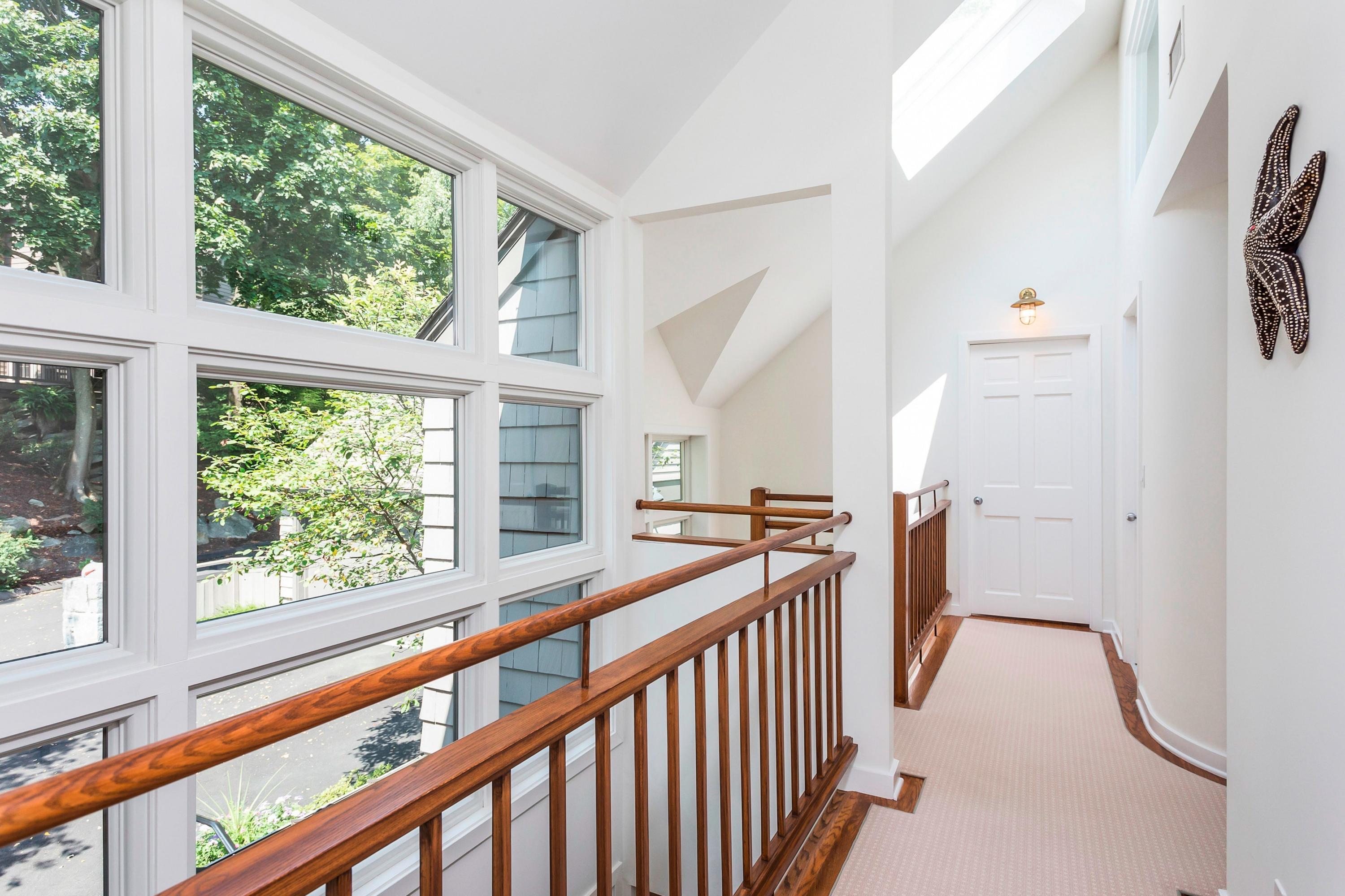 17 Thomas Place Rowayton, CT 06853 - Photo 15 of 37 a view of a hallway with furniture and windows