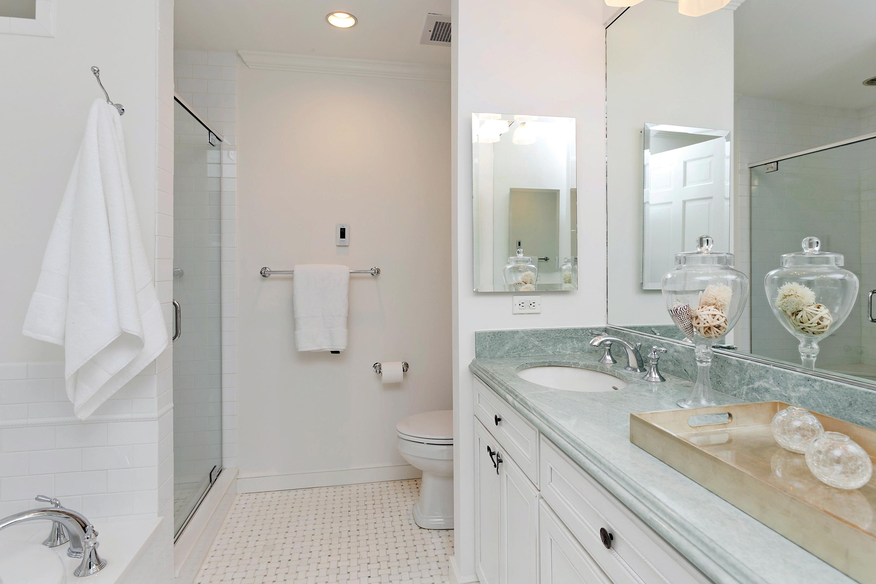 17 Thomas Place Rowayton, CT 06853 - Photo 19 of 37 a bathroom with a granite countertop sink a toilet and shower