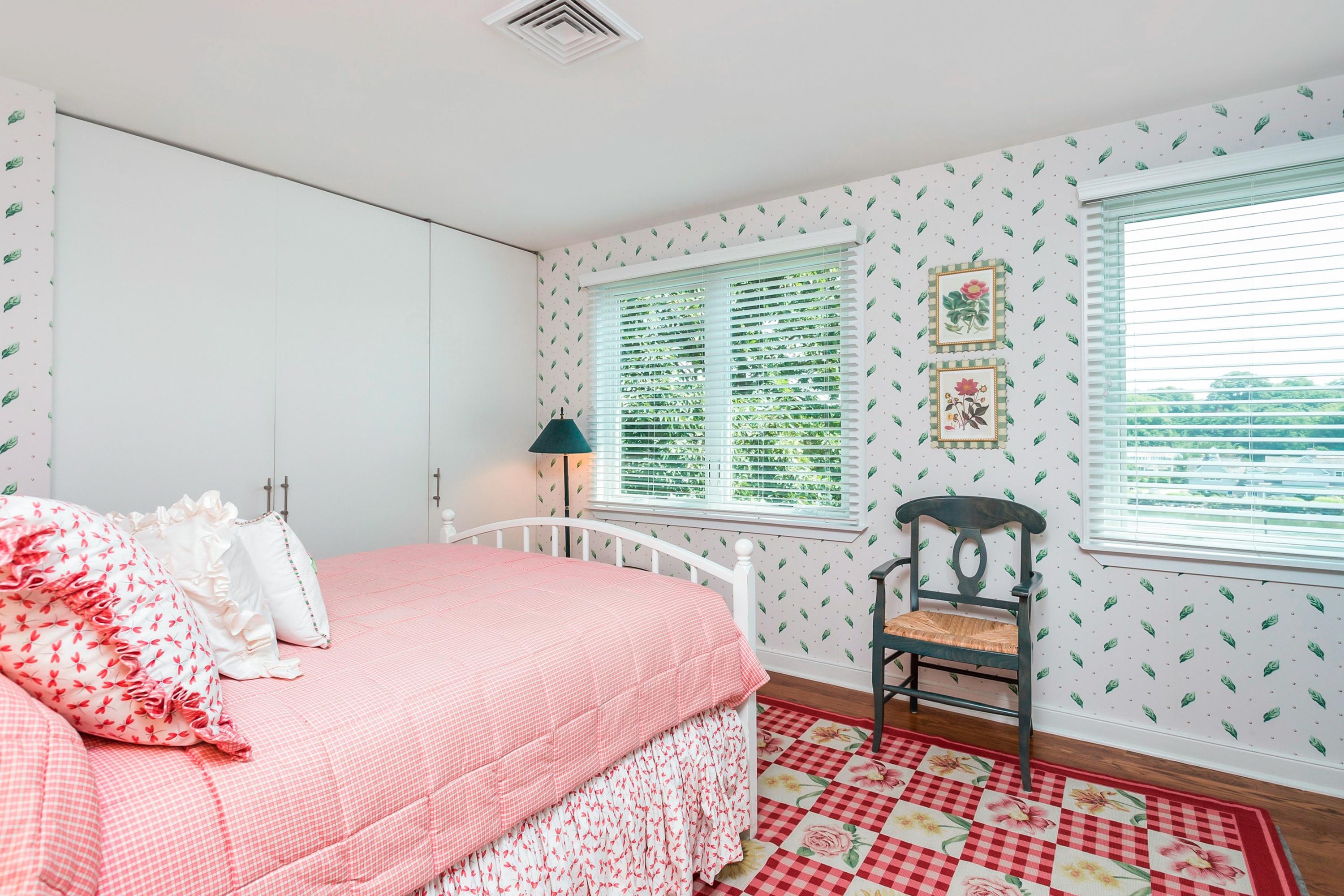17 Thomas Place Rowayton, CT 06853 - Photo 20 of 37 a bedroom with a bed and a chair