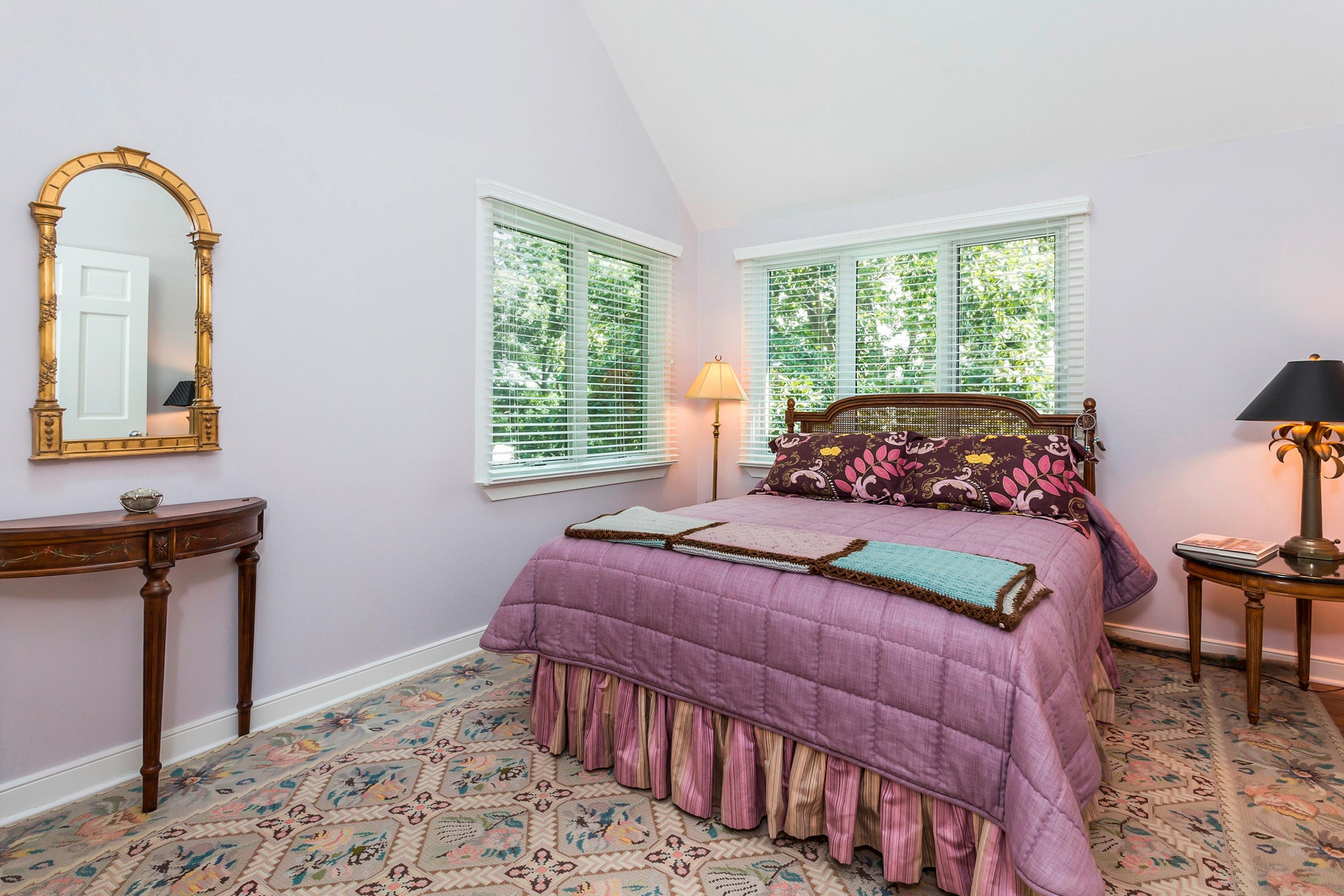17 Thomas Place Rowayton, CT 06853 - Photo 22 of 37 a bedroom with a bed a dresser and windows