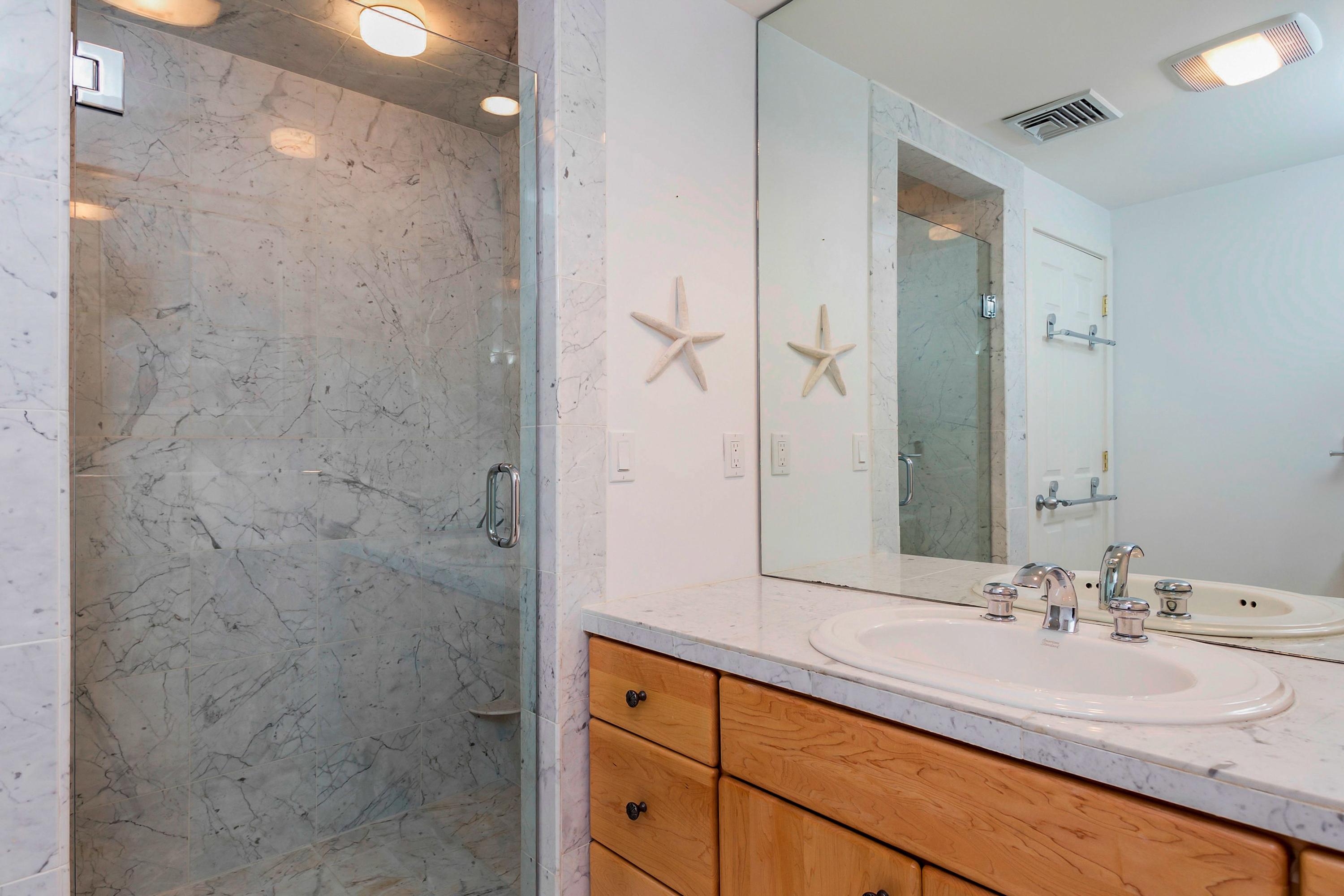 17 Thomas Place Rowayton, CT 06853 - Photo 25 of 37 a bathroom with a sink and a mirror