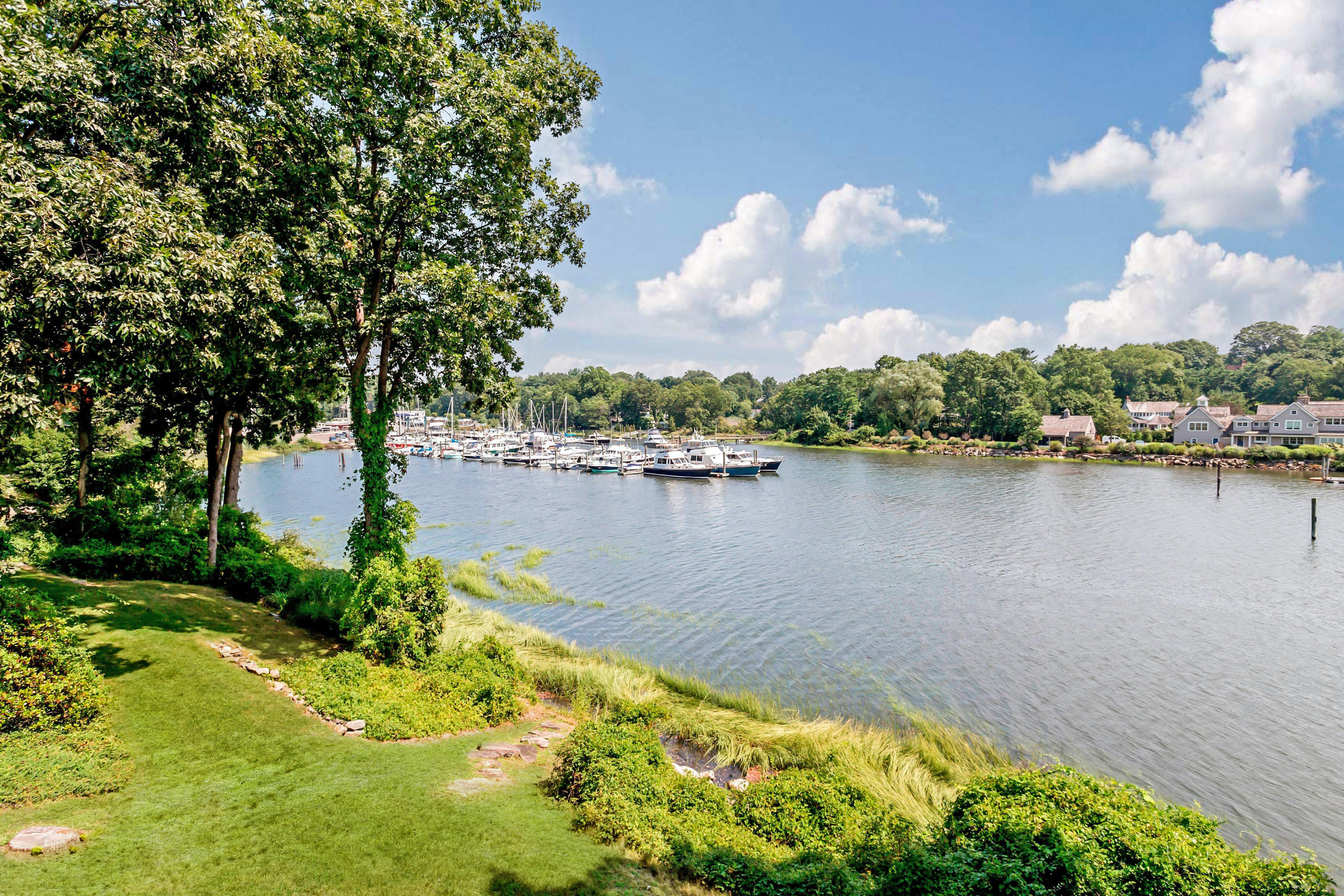 17 Thomas Place Rowayton, CT 06853 - Photo 3 of 37 a view of a lake with houses in the back