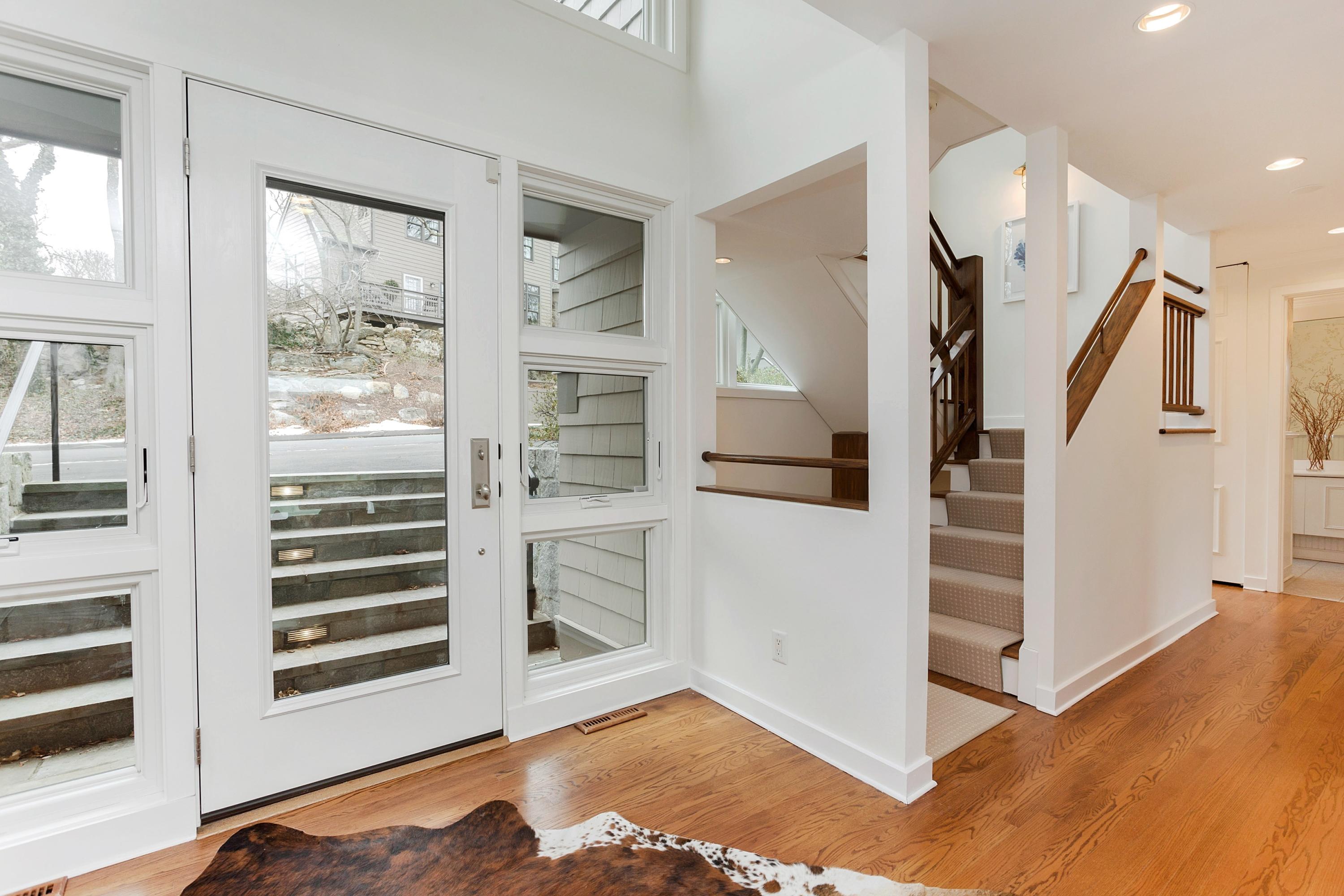17 Thomas Place Rowayton, CT 06853 - Photo 5 of 37 a view of a hallway with windows and entryway