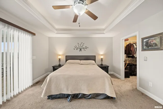 a view of walk in closet with clothes