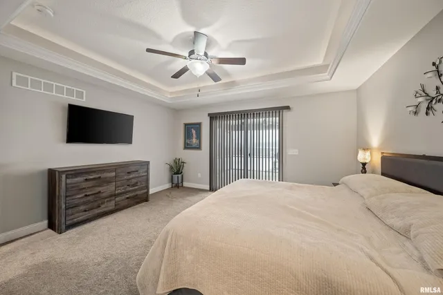 a bedroom with furniture and a window