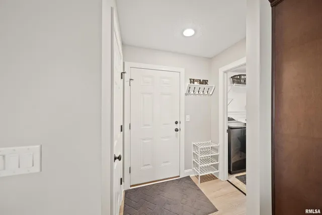 an empty room with furniture and a fireplace