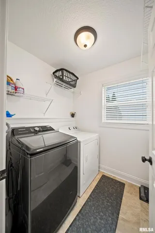 a view of a livingroom with furniture and a flat screen tv