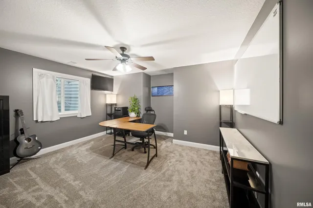 a spacious bedroom with a bed and wooden floor