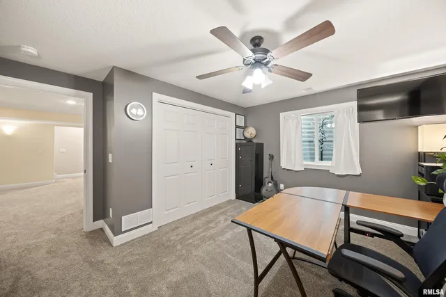 a bedroom with furniture and a wooden floor