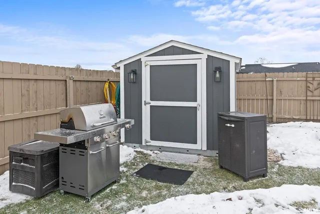 a view of yard with swimming pool and seating