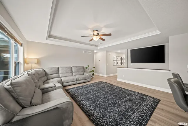 a living room with furniture and a rug