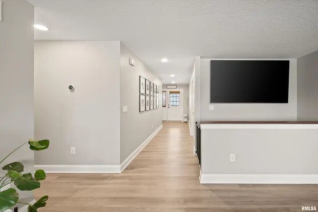 a view of a livingroom with furniture window and wooden floor