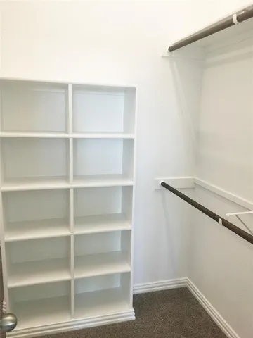 a view of an empty walk in closet