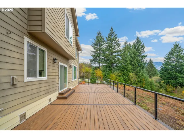 a view of backyard with a deck