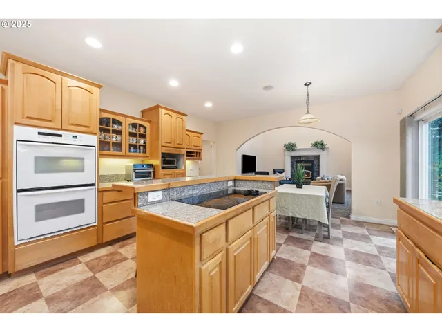 a kitchen with a sink stainless steel appliances and cabinets