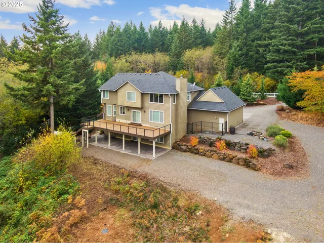 a front view of a house with a yard and seating area