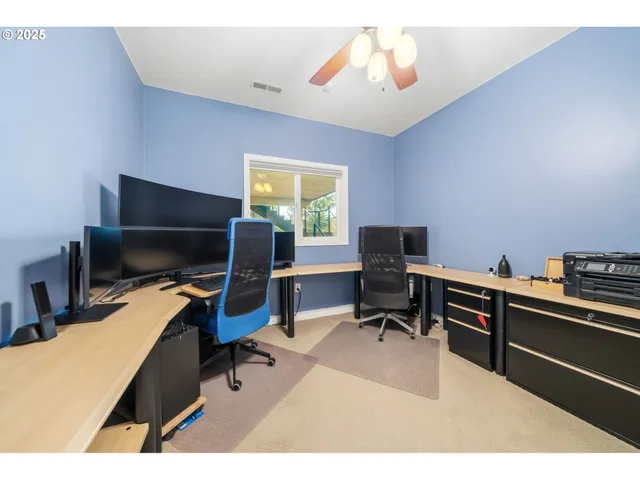 a bedroom with a workspace