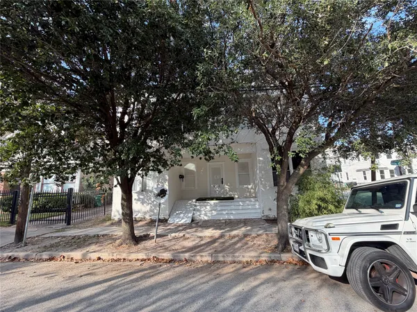 a view of street and car parked