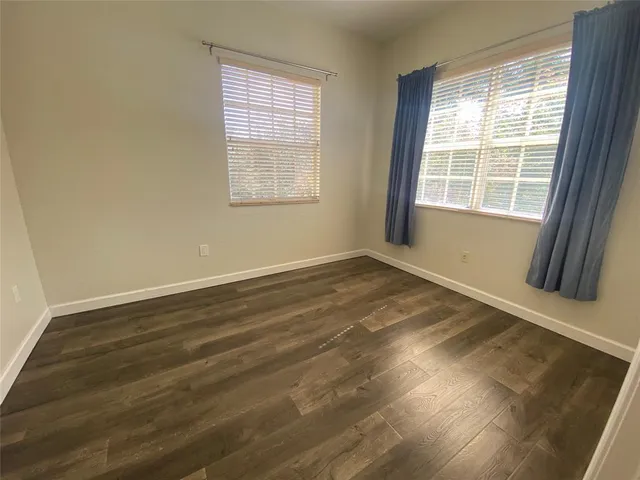 a view of front of a house with a garden