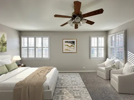 a bedroom with a large bed and a window
