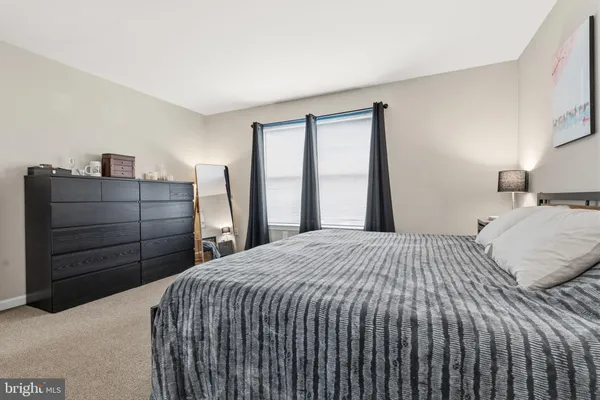 a bedroom with a bed and a closet