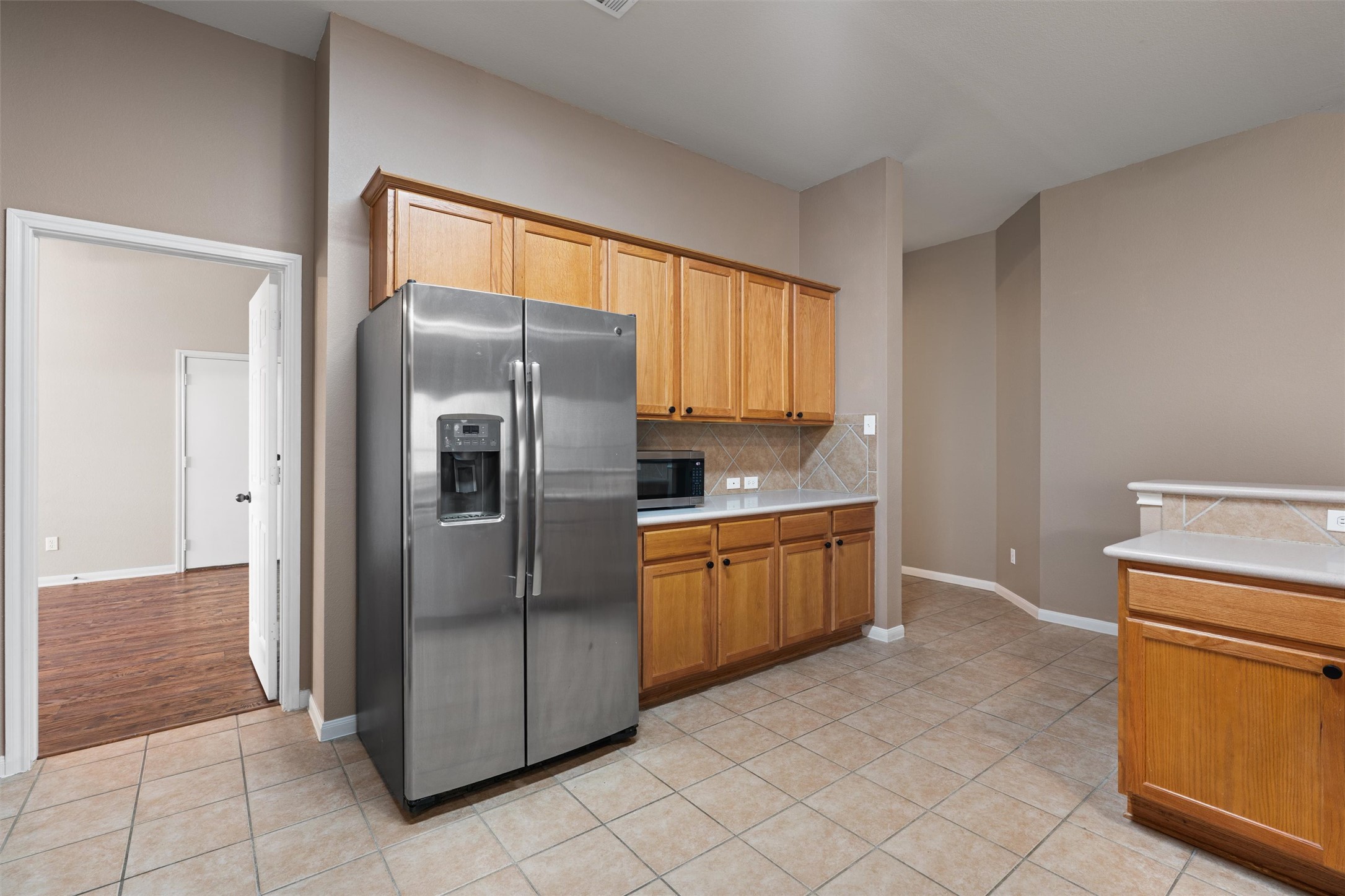 407 Red Hawk Drive Leander, TX 78641 - Photo 11 of 34 a kitchen with stainless steel appliances granite countertop a refrigerator and a sink