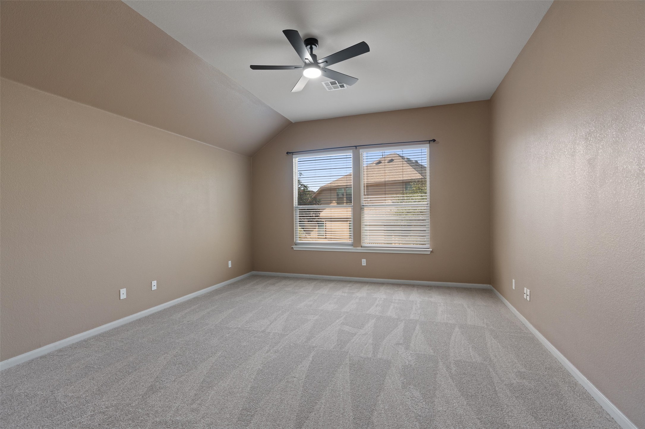 407 Red Hawk Drive Leander, TX 78641 - Photo 17 of 34 wooden floor in an empty room with a window