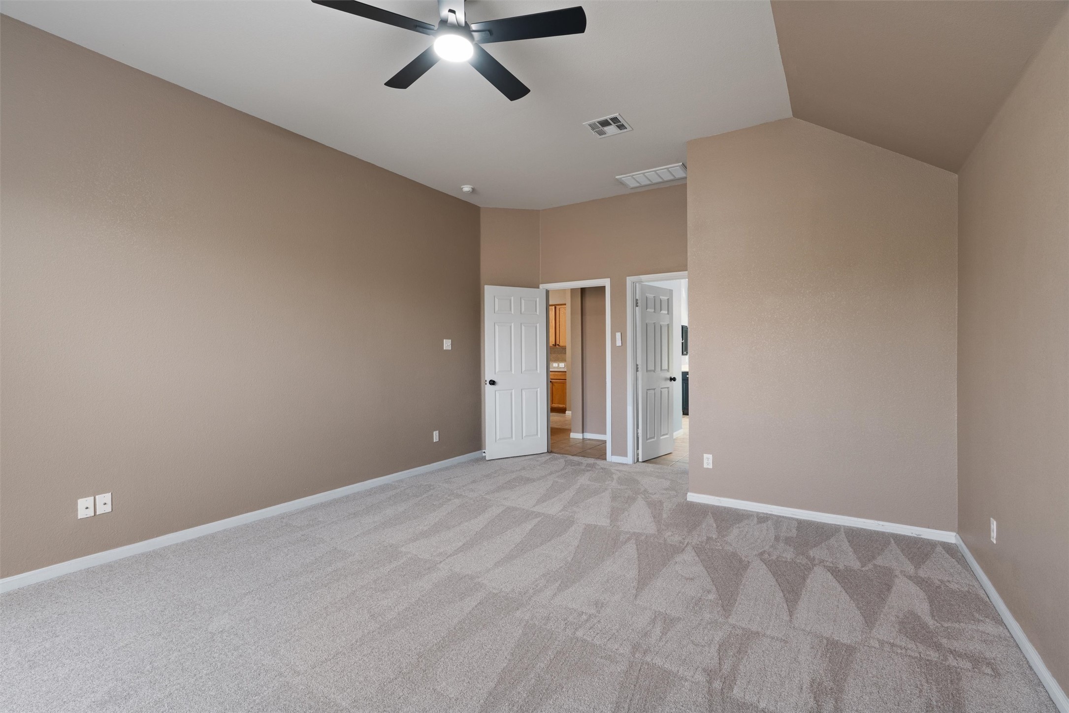 407 Red Hawk Drive Leander, TX 78641 - Photo 18 of 34 a view of an empty room with a chandelier fan